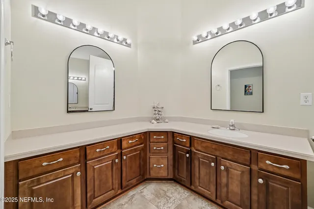 a view of walk in closet with clothes