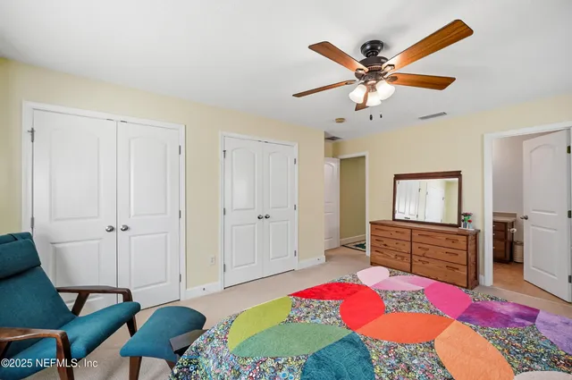 a living room with furniture a rug and a fireplace