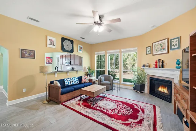 a bathroom with a toilet and a shower curtain