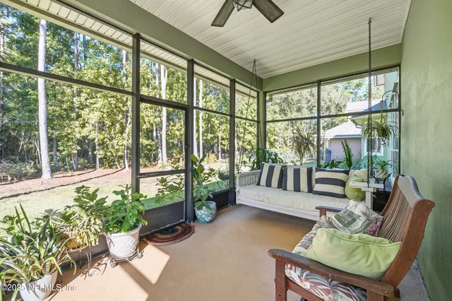 a living room with large windows