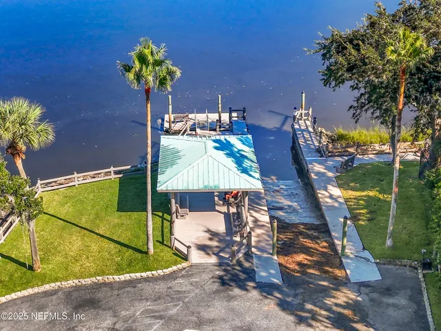 an aerial view of a house with outdoor space