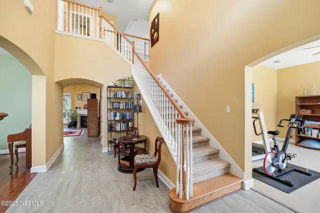 a view of an entryway with wooden floor