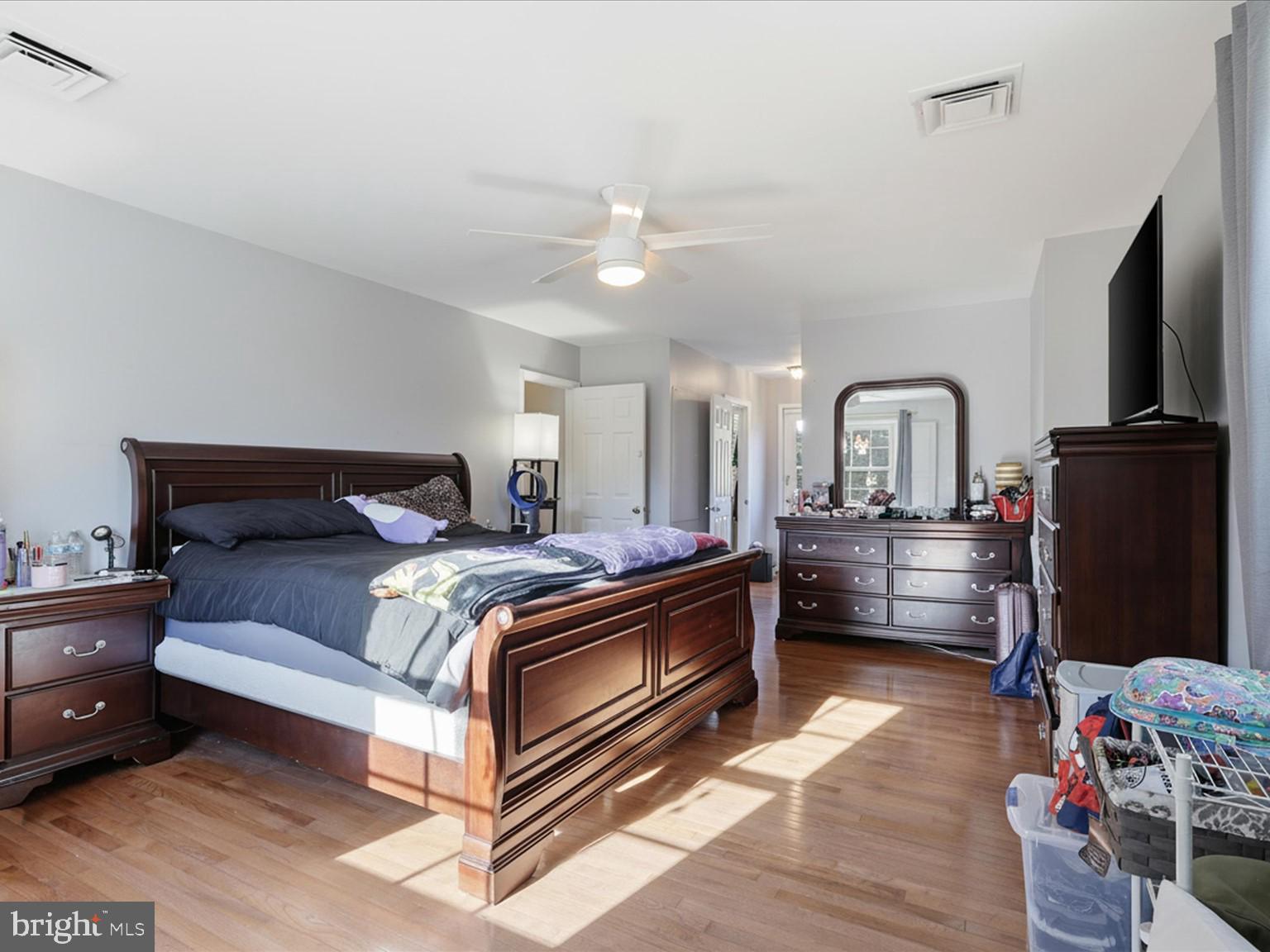 11130 Chapel Road Fairfax Station, VA 22039 - Photo 14 of 55 a bed room with a bed and a television