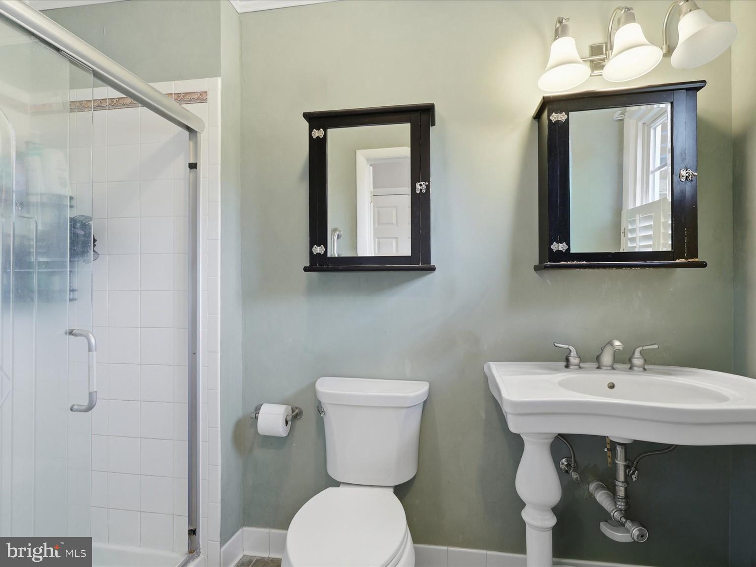 11130 Chapel Road Fairfax Station, VA 22039 - Photo 15 of 55 a bathroom with a toilet sink and mirror