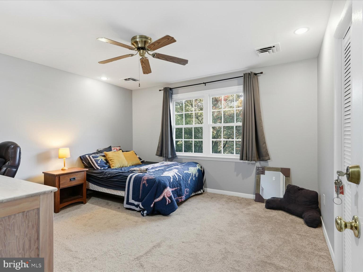 11130 Chapel Road Fairfax Station, VA 22039 - Photo 19 of 55 a bed room with a bed and a window