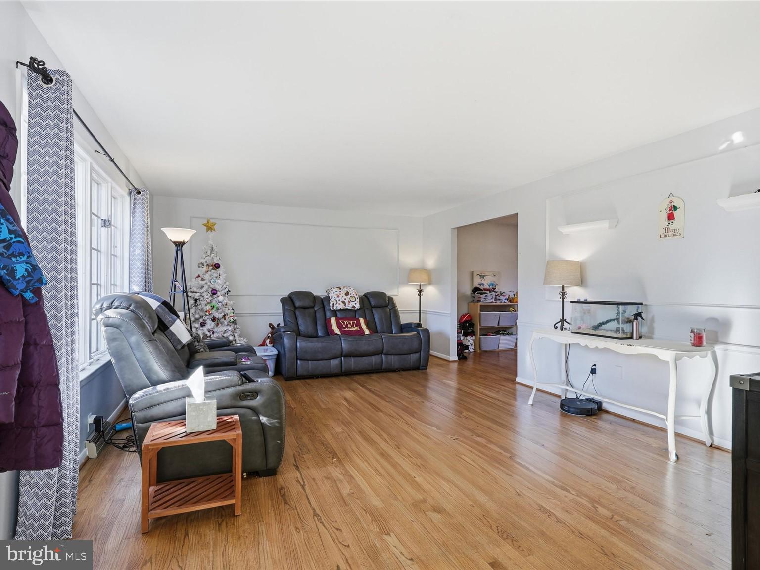 11130 Chapel Road Fairfax Station, VA 22039 - Photo 26 of 55 a living room with furniture and a wooden floor