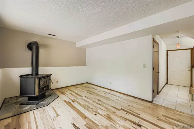 a view of a room with wooden floor