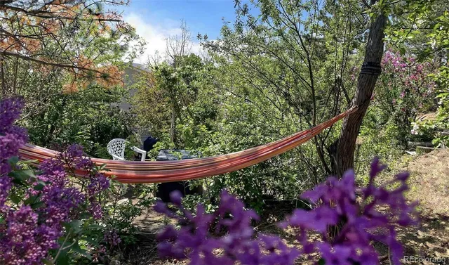 a view of a tables and chairs under an umbrella