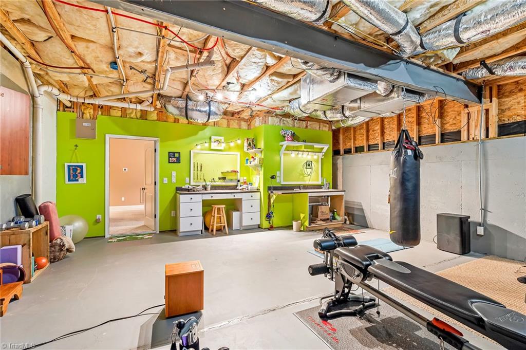 5005 Robdot Drive Oak Ridge, NC 27310 - Photo 41 of 50 Basement gym/craft space