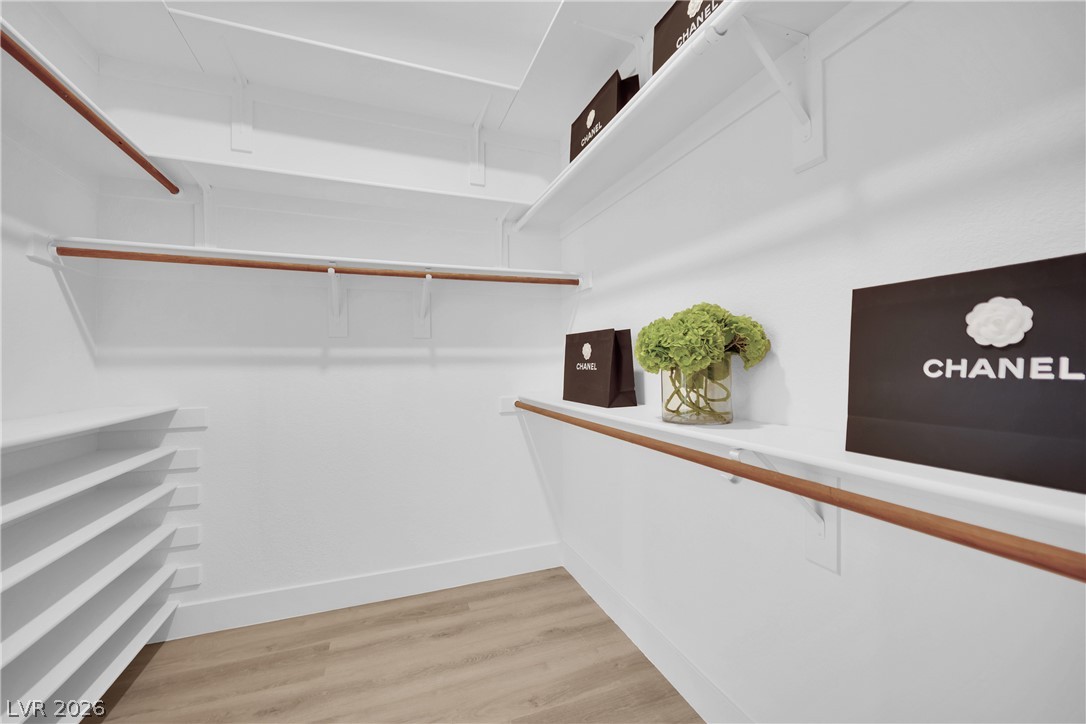 8981 Rivers Edge Drive Las Vegas, NV 89117 - Photo 36 of 69 Ample shelving and hanging space defines this well-organized walk-in closet.