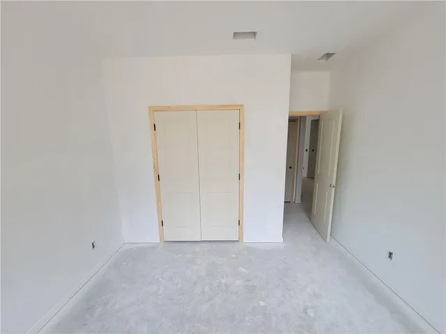 a living room with stainless steel appliances kitchen island a cabinets and a counter top