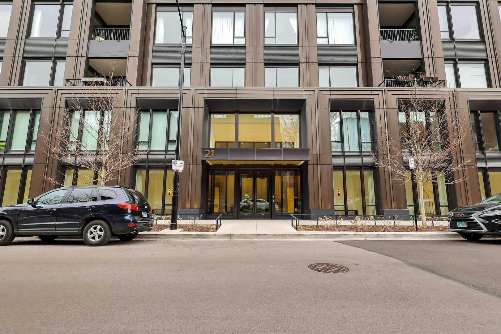21 North May Street, Unit 501 Chicago, IL 60607 - Photo 1 of 82 a building with car parked in front of it