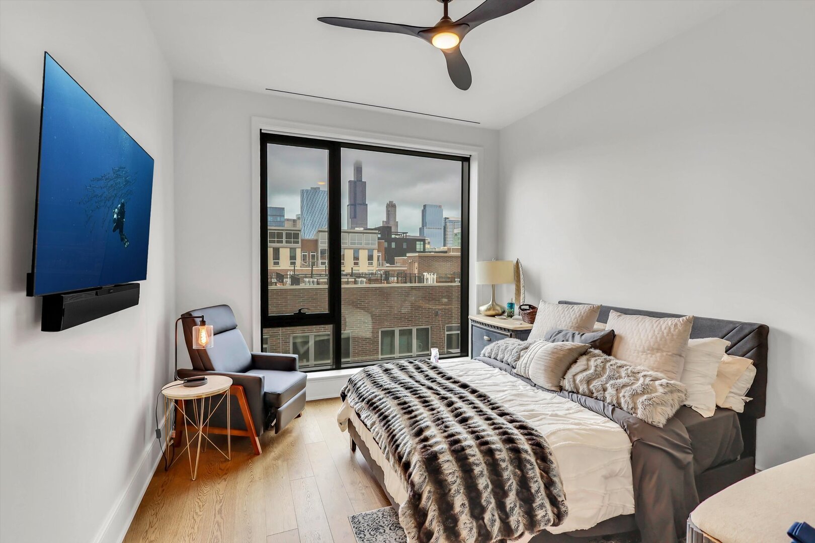21 North May Street, Unit 501 Chicago, IL 60607 - Photo 37 of 82 a bedroom with a bed and a table