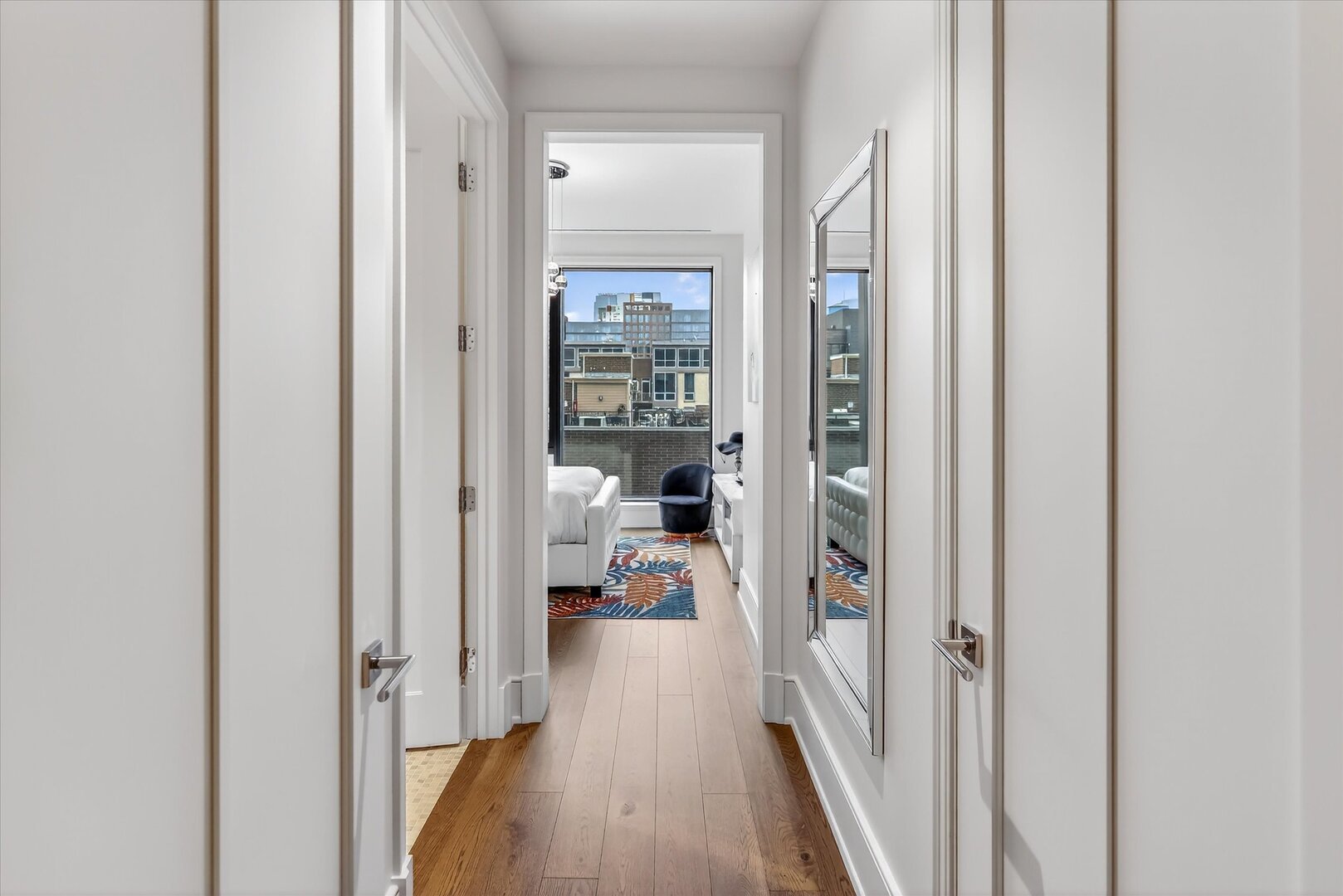 21 North May Street, Unit 501 Chicago, IL 60607 - Photo 42 of 82 a view of a hallway with wooden floor and a living room