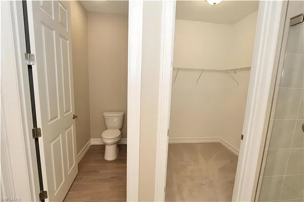 a view of a bathroom from a hallway