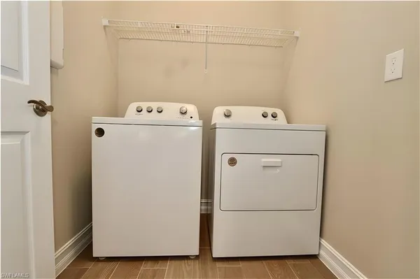 a utility room with dryer and washer