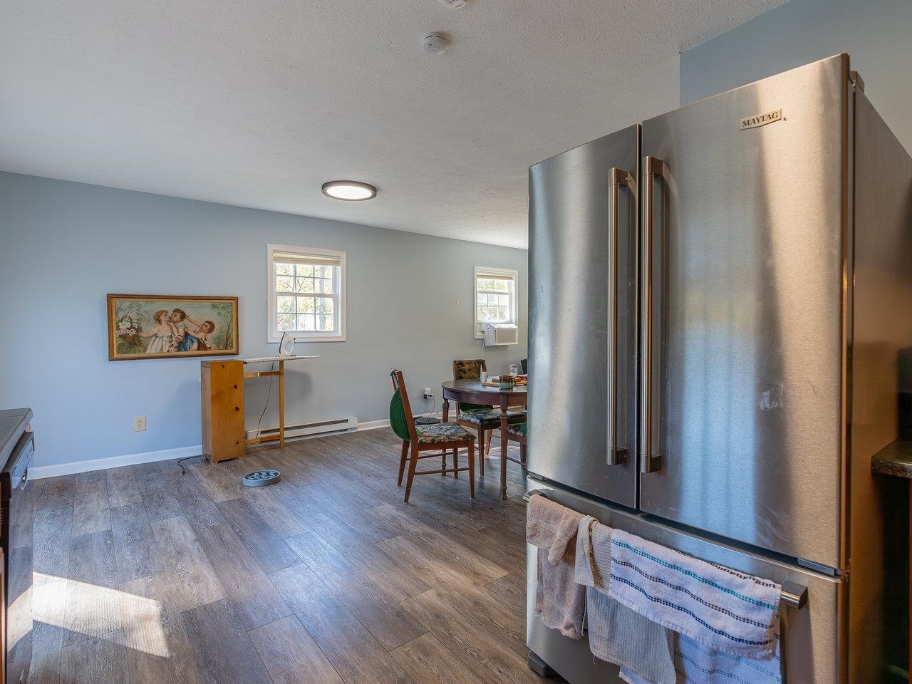 49 See Lane Mathias, WV 26812 - Photo 13 of 55 a living room with stainless steel appliances wooden floors and a window