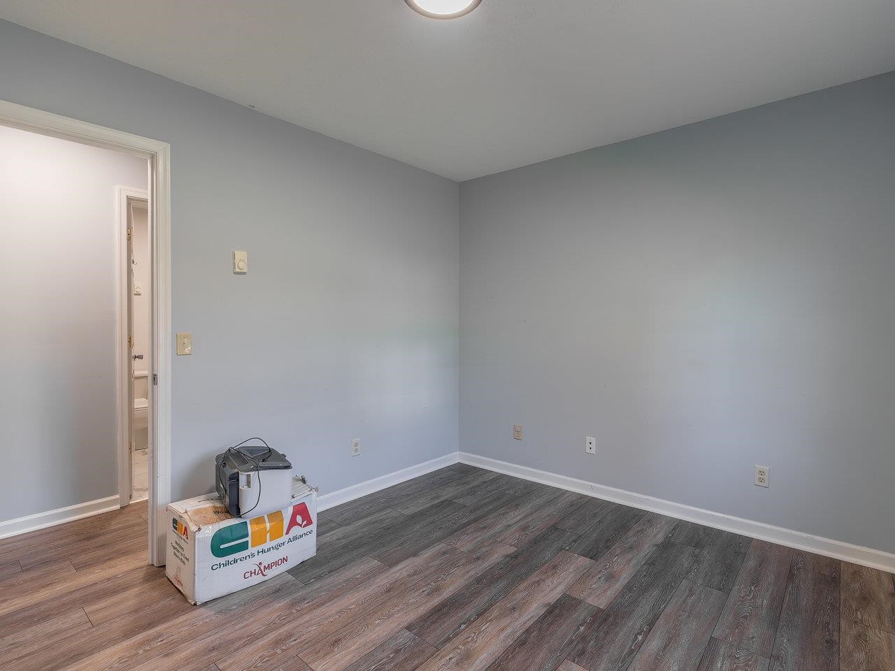 49 See Lane Mathias, WV 26812 - Photo 29 of 55 a room with wooden floor and shoes