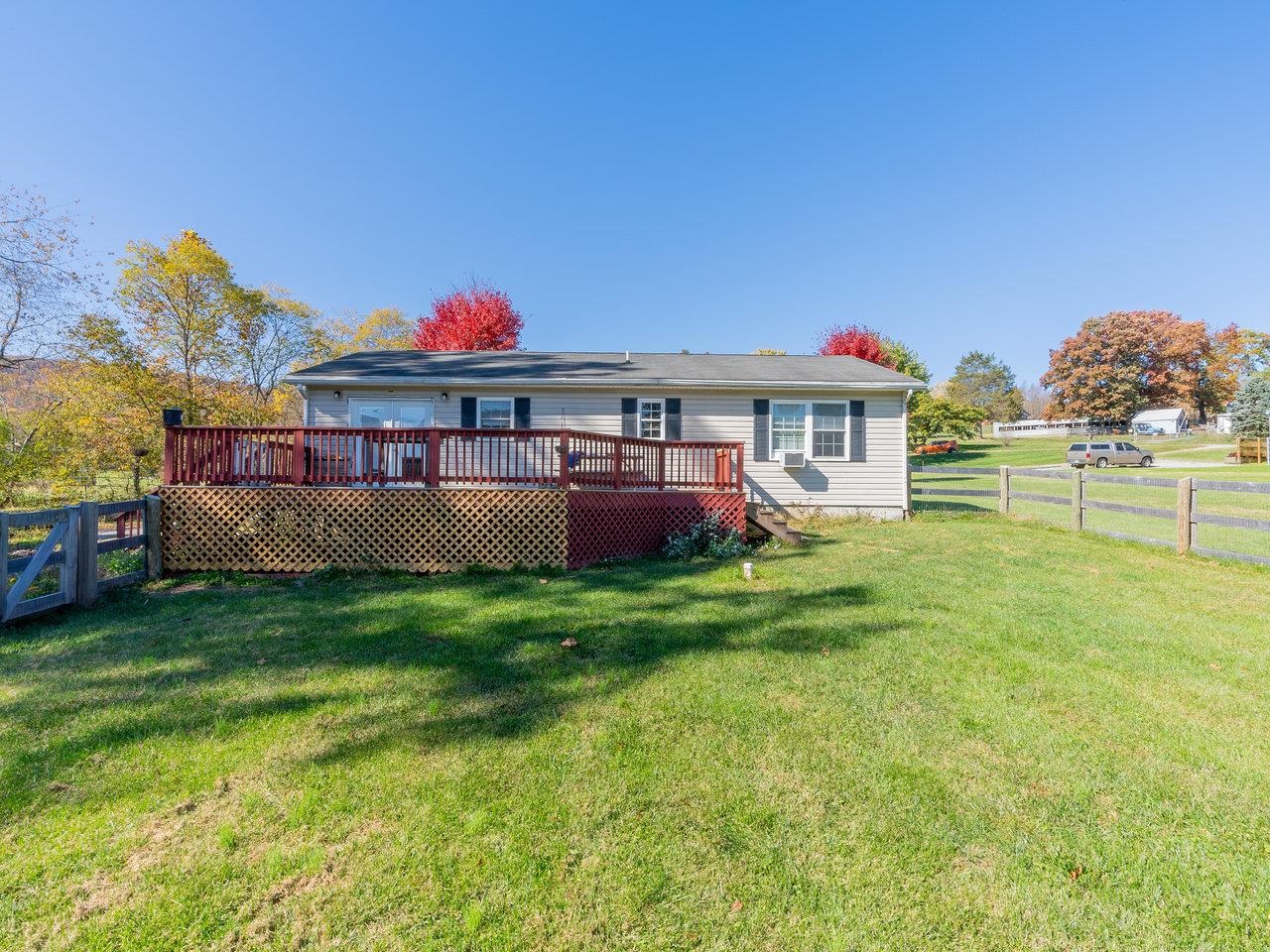 49 See Lane Mathias, WV 26812 - Photo 40 of 55 a view of a house with a backyard and a patio