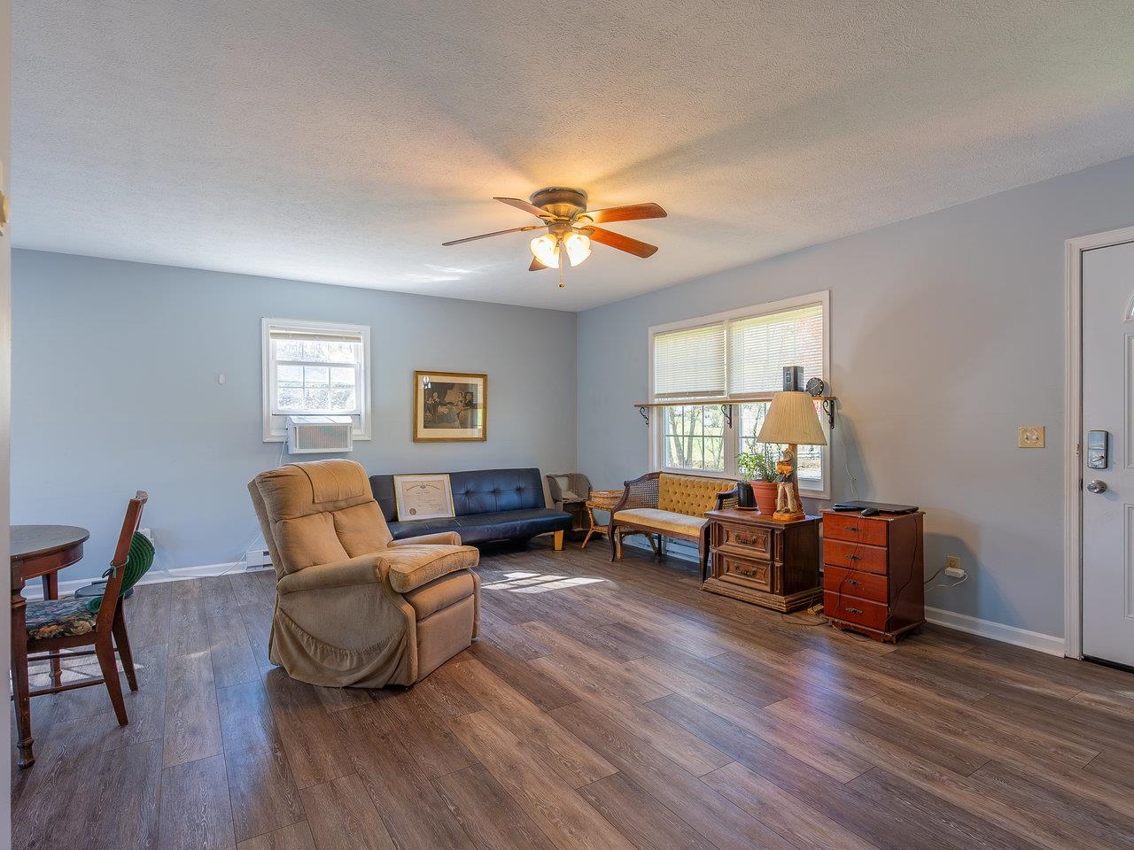 49 See Lane Mathias, WV 26812 - Photo 7 of 55 a living room with furniture and a window