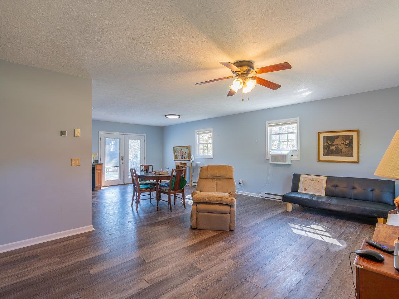 49 See Lane Mathias, WV 26812 - Photo 8 of 55 a living room with furniture and a wooden floor