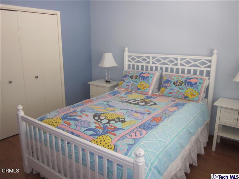 2716 Ridgepine Drive La Crescenta, CA 91214 - Photo 15 of 40 a bedroom with a bed and a table in it