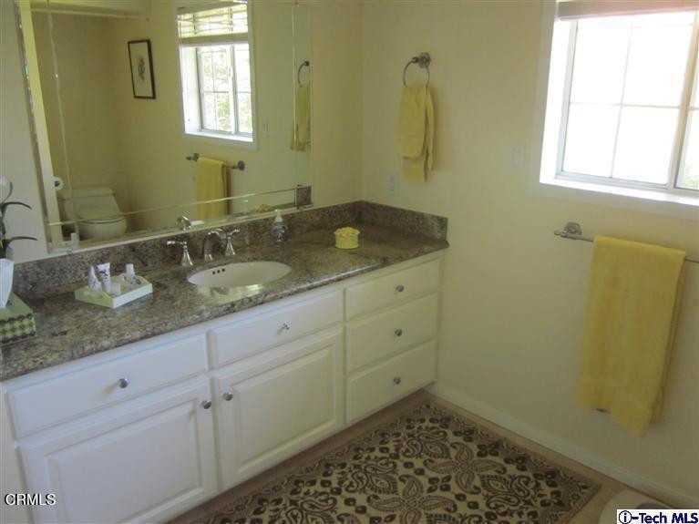 2716 Ridgepine Drive La Crescenta, CA 91214 - Photo 20 of 40 a bathroom with a sink a vanity and a mirror