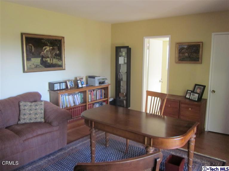 2716 Ridgepine Drive La Crescenta, CA 91214 - Photo 25 of 40 a living room with furniture a table and wooden floor