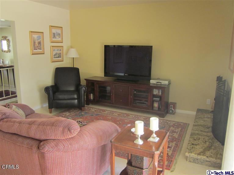 2716 Ridgepine Drive La Crescenta, CA 91214 - Photo 26 of 40 a living room with furniture and a flat screen tv
