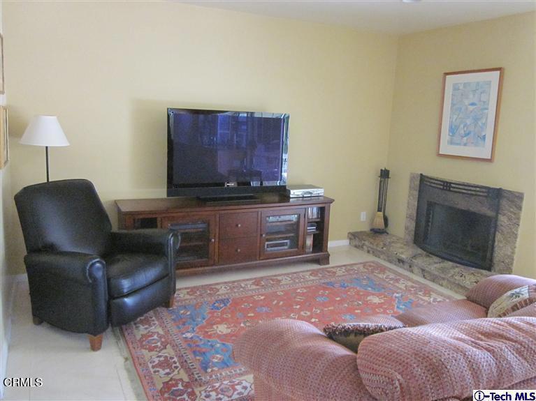 2716 Ridgepine Drive La Crescenta, CA 91214 - Photo 28 of 40 a living room with furniture and a fireplace