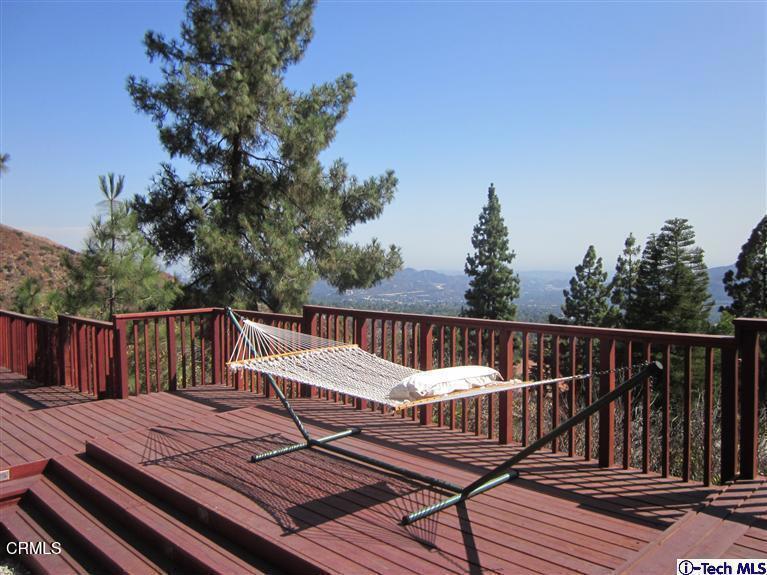 2716 Ridgepine Drive La Crescenta, CA 91214 - Photo 32 of 40 a view of a wooden deck with a patio