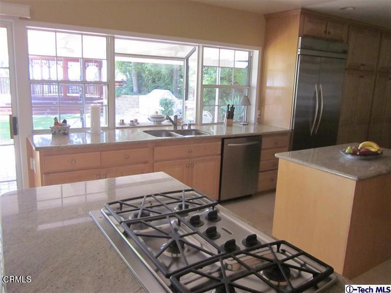 2716 Ridgepine Drive La Crescenta, CA 91214 - Photo 8 of 40 a kitchen with a stove a sink and a refrigerator
