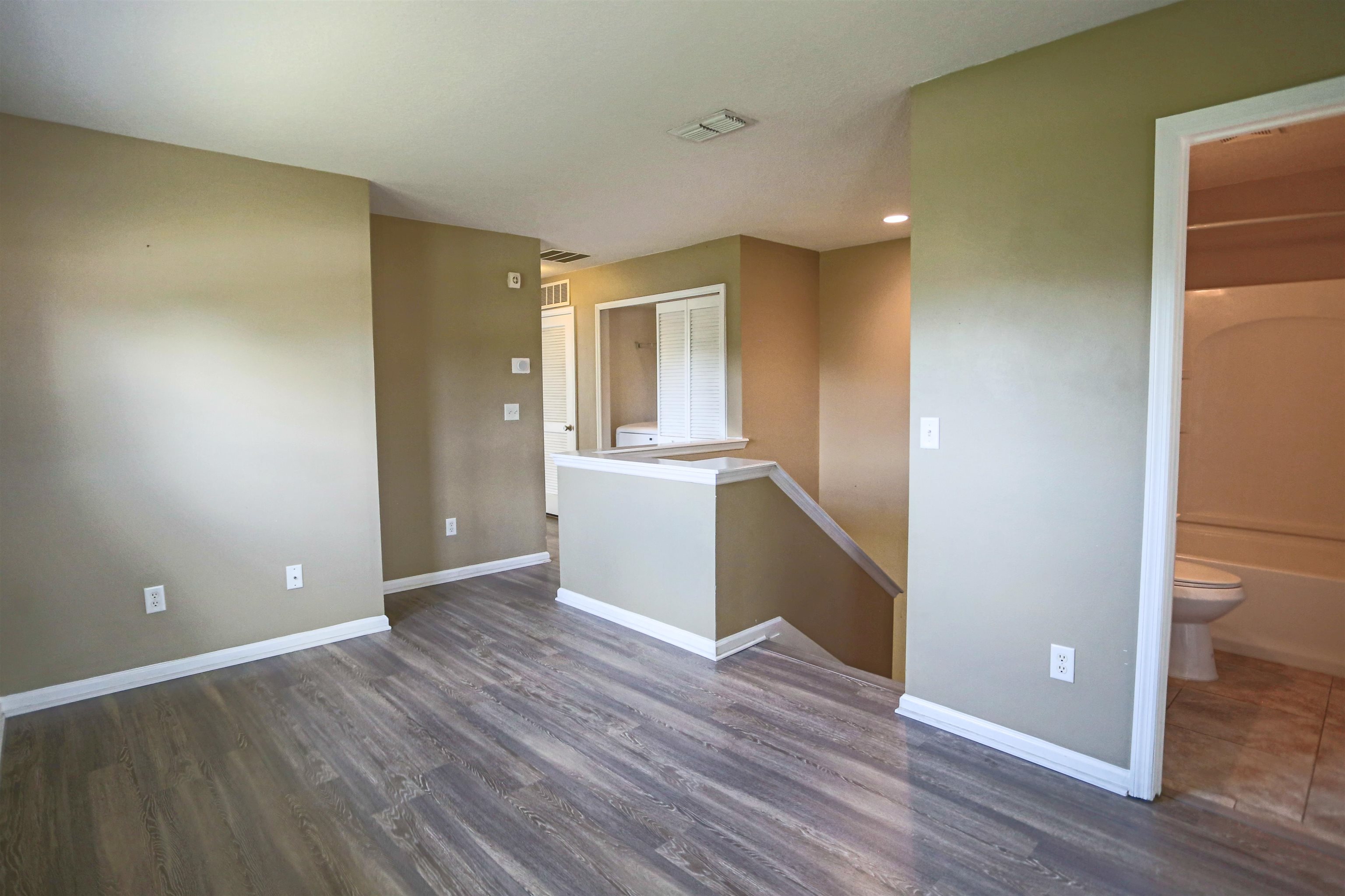 104 Crete Court St. Augustine, FL 32084 - Photo 16 of 32 a view of a kitchen with wooden floor and electronic appliances