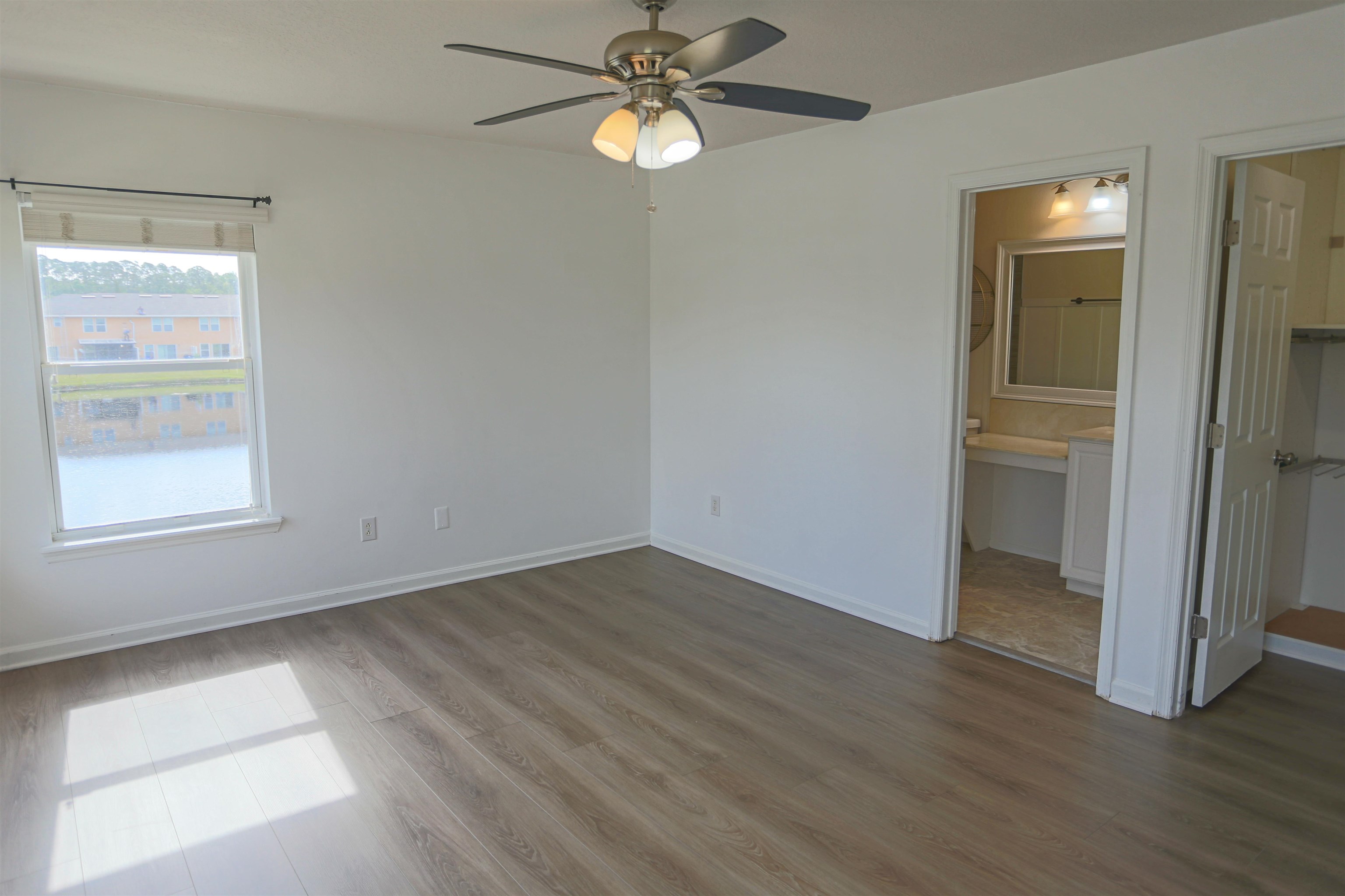 104 Crete Court St. Augustine, FL 32084 - Photo 20 of 32 an empty room with wooden floor closet and windows