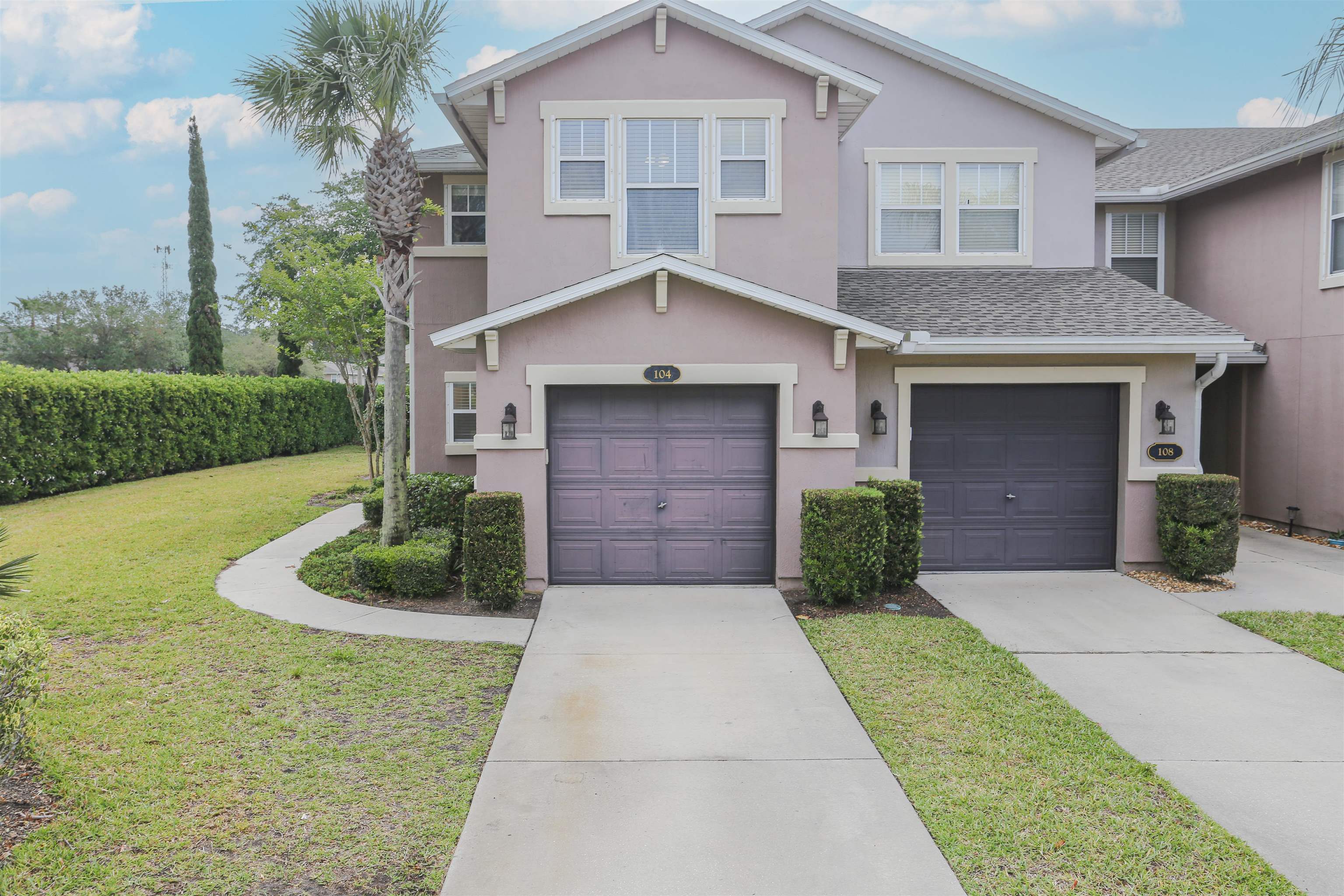 104 Crete Court St. Augustine, FL 32084 - Photo 2 of 32 a front view of a house with a yard and garage
