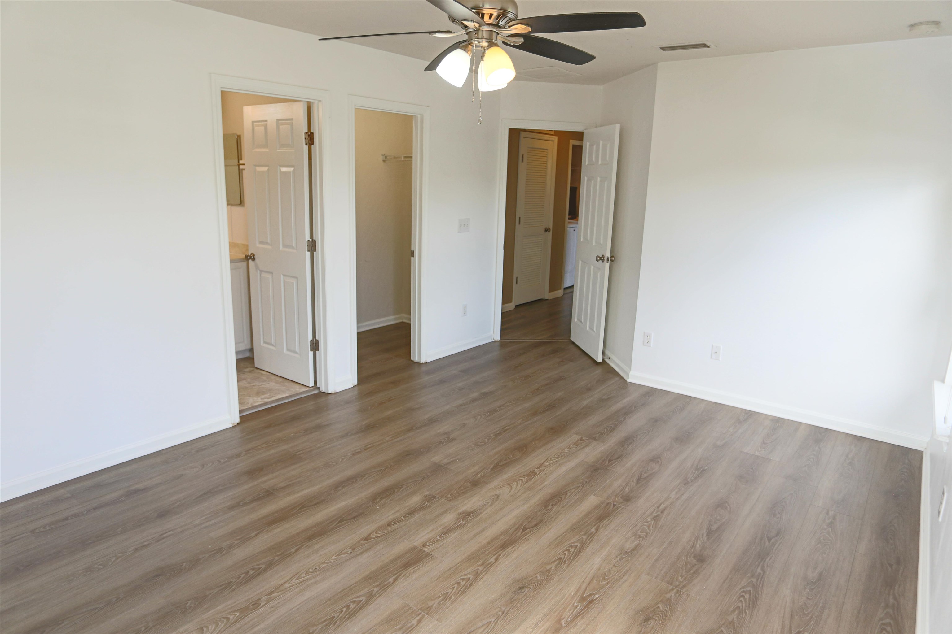 104 Crete Court St. Augustine, FL 32084 - Photo 21 of 32 a view of an empty room with wooden floor