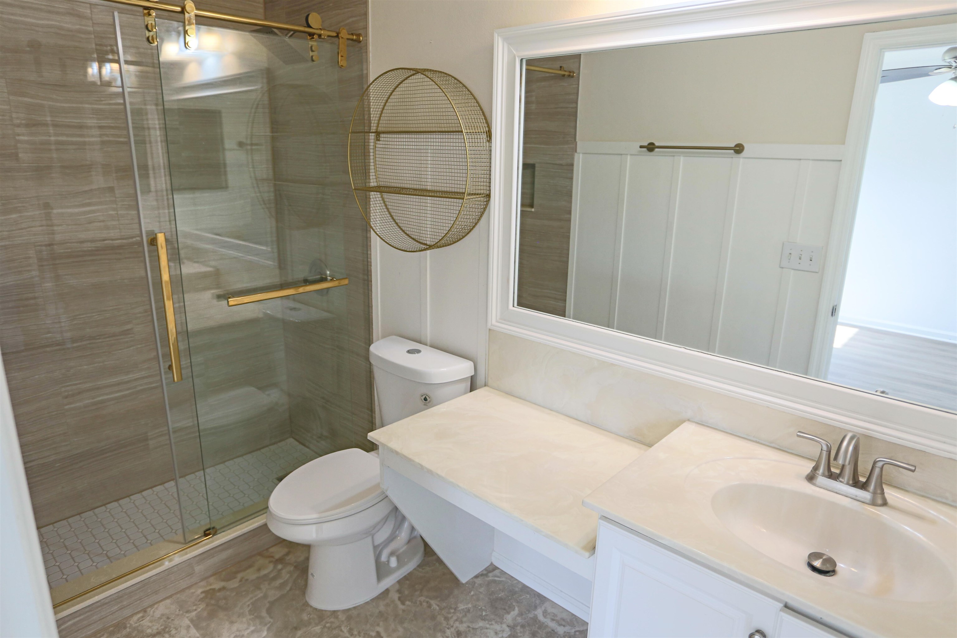 104 Crete Court St. Augustine, FL 32084 - Photo 22 of 32 a bathroom with a toilet a sink and shower