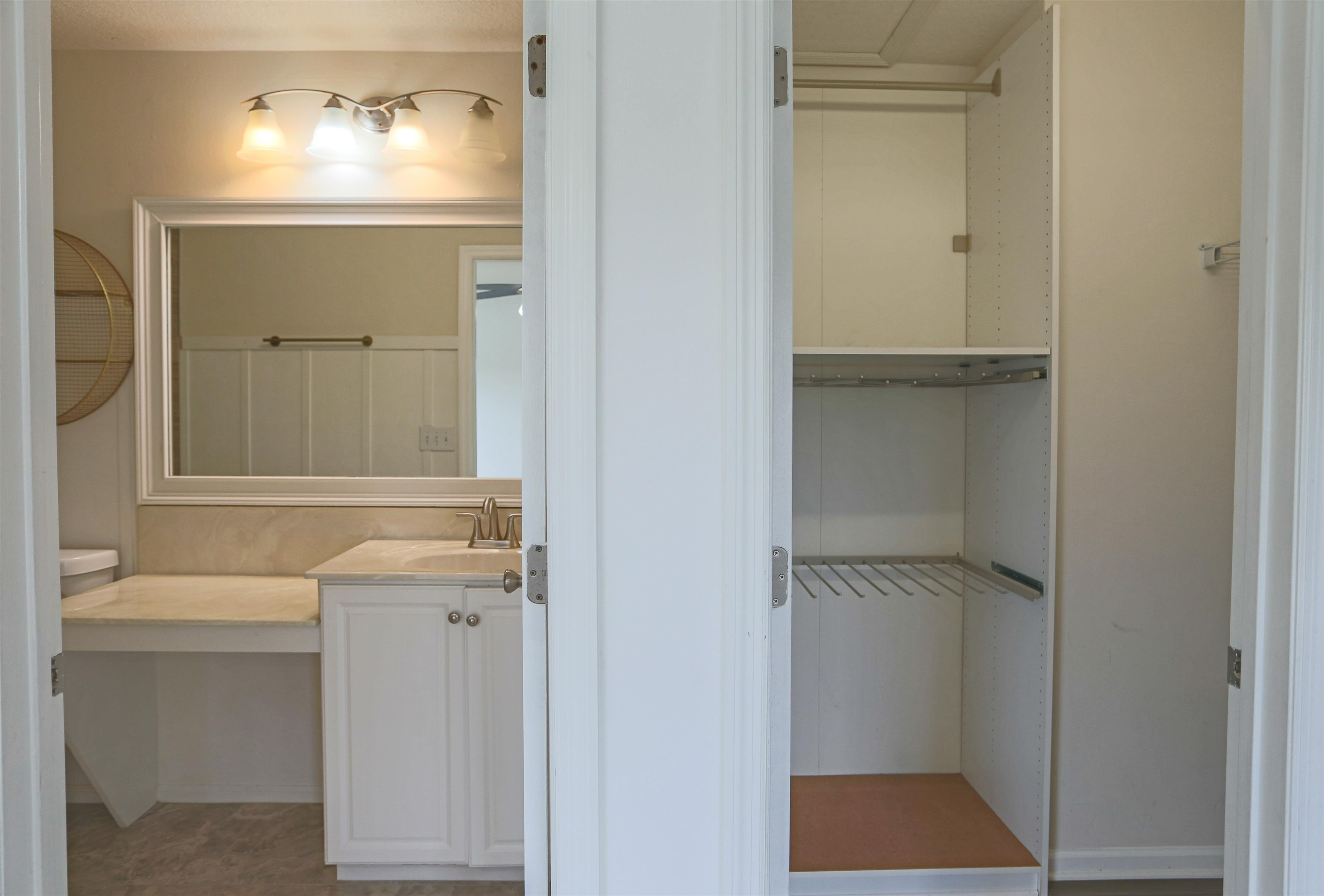 104 Crete Court St. Augustine, FL 32084 - Photo 24 of 32 a bathroom with a sink and a mirror