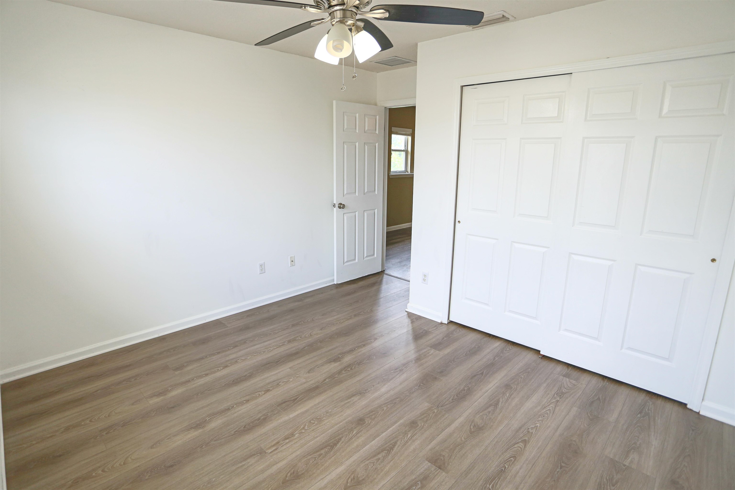 104 Crete Court St. Augustine, FL 32084 - Photo 27 of 32 a view of an empty room with wooden floor