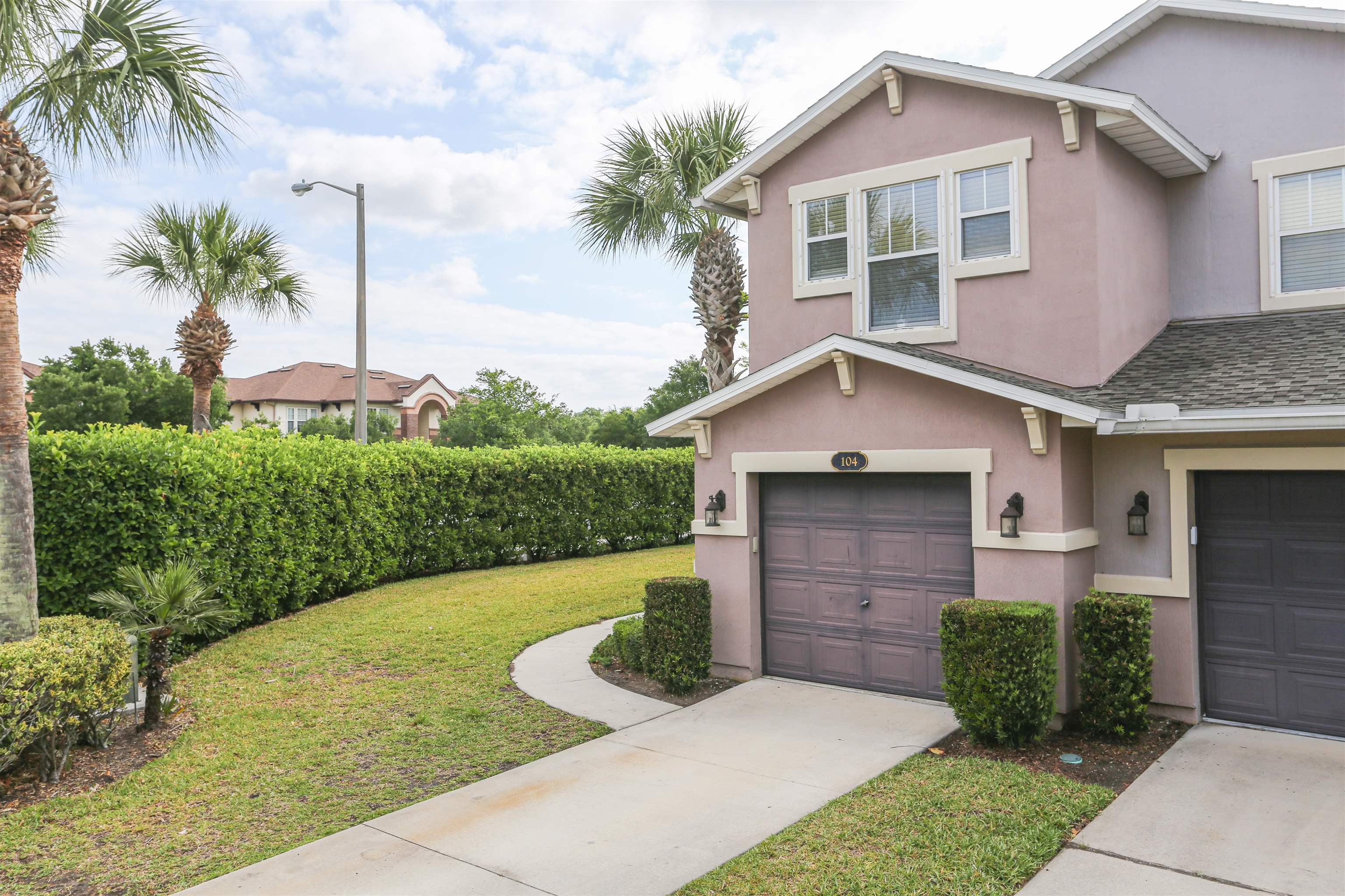 104 Crete Court St. Augustine, FL 32084 - Photo 3 of 32 a front view of a house with garden