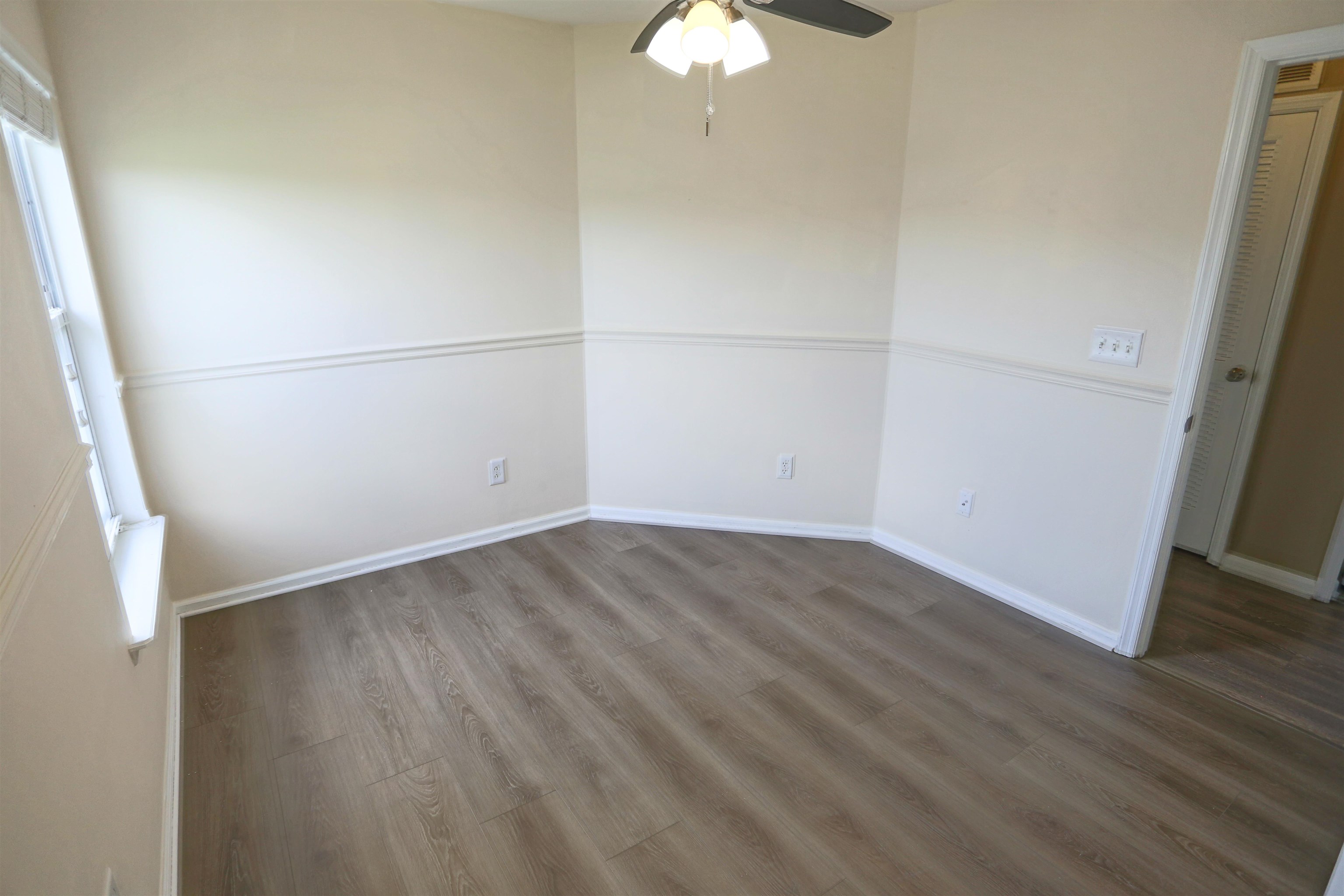 104 Crete Court St. Augustine, FL 32084 - Photo 31 of 32 an empty room with wooden floor and door