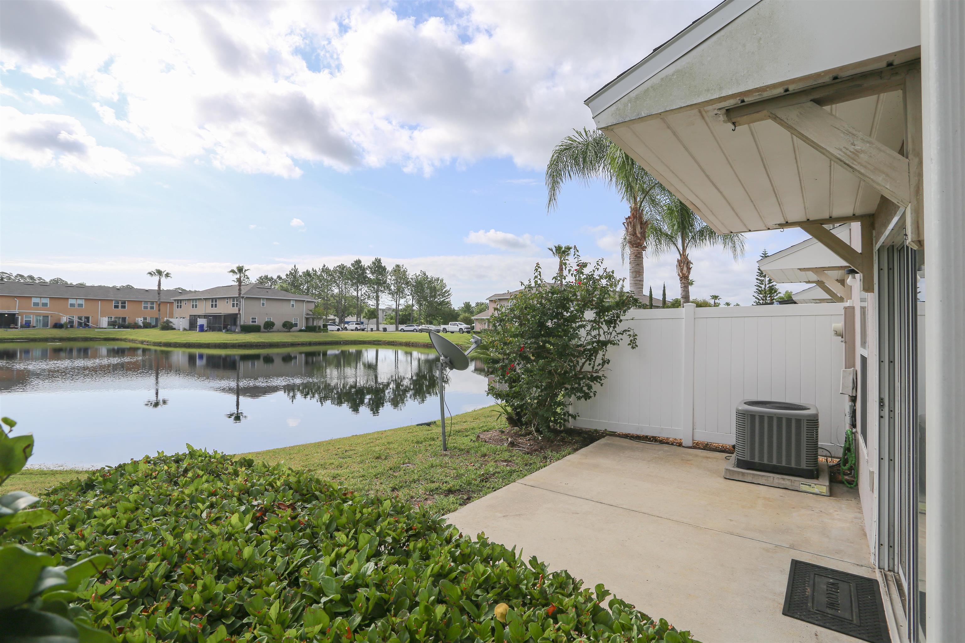 104 Crete Court St. Augustine, FL 32084 - Photo 6 of 32 a view of a lake with a house in the background