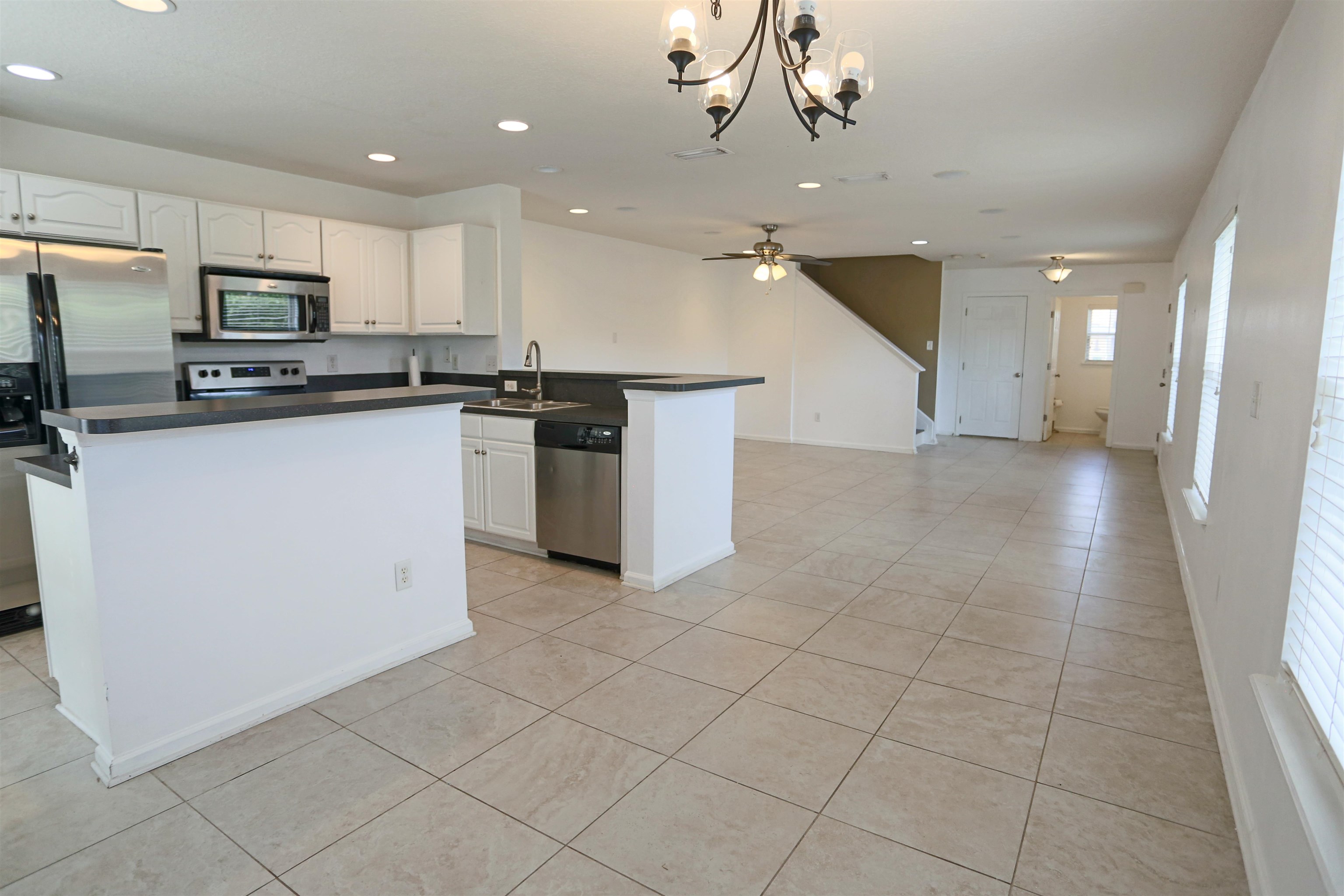 104 Crete Court St. Augustine, FL 32084 - Photo 9 of 32 a kitchen with stainless steel appliances a refrigerator sink and microwave