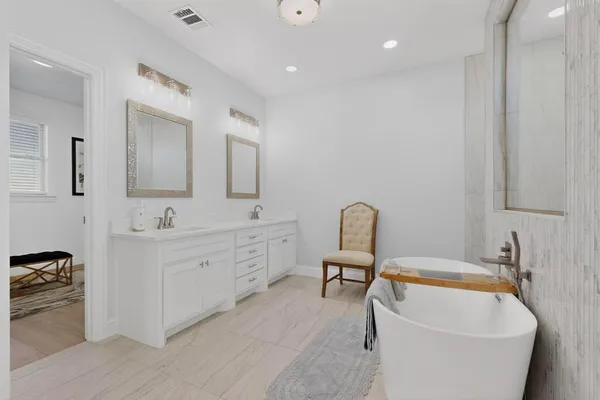 a bathroom with a bathtub sink and toilet