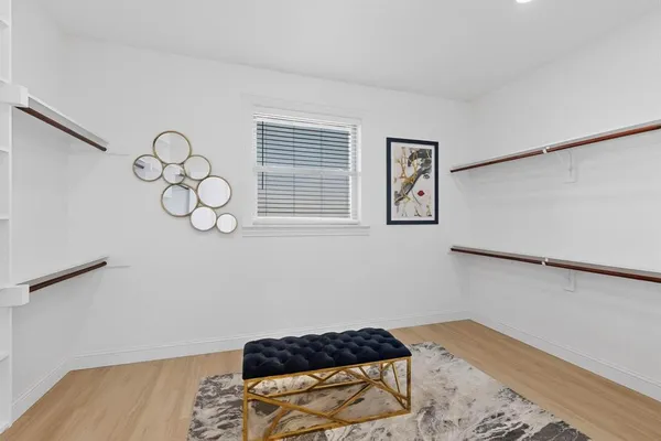a bedroom with a bed and cabinets
