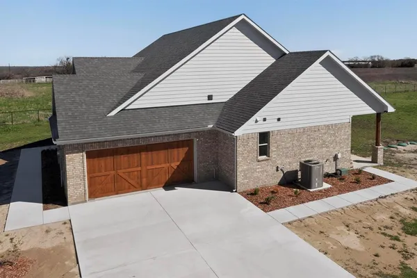 a front view of a house with a garage