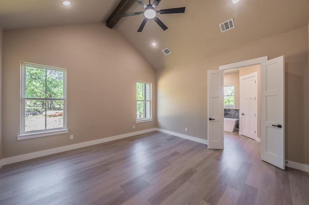 114 Ridgeline Drive Chico, TX 76431 - Photo 14 of 38 Primary Bedroom with Ensuite Bathroom