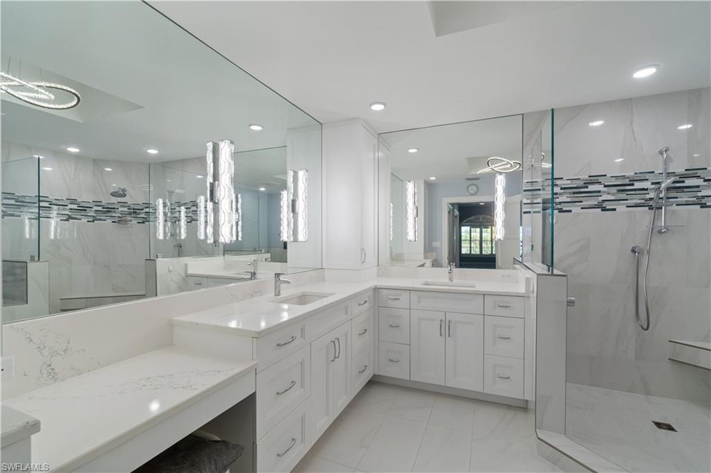 567 Audubon Boulevard, Unit D301 Naples, FL 34110 - Photo 13 of 37 Beautifully updated Primary bathroom