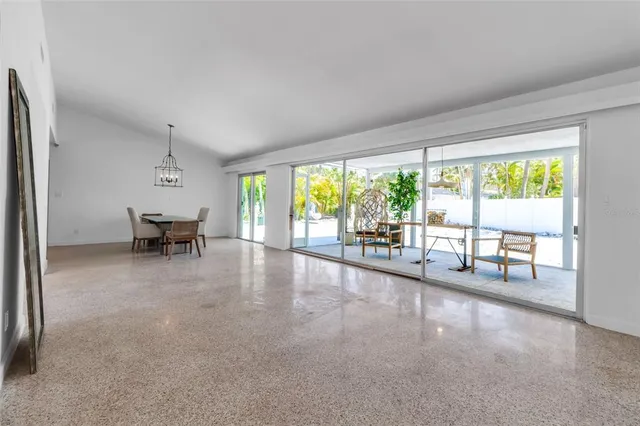 a view of work space with wooden floor and windows