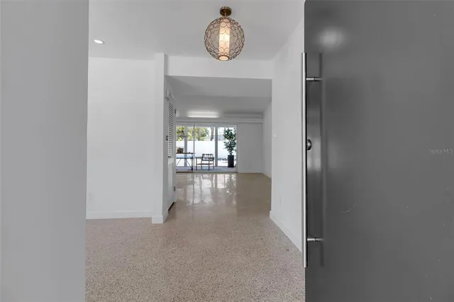 a kitchen with stainless steel appliances a sink and a microwave